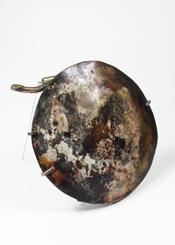 Roxy Lentz Brooch of up cycled silver plate tray, fire patina.