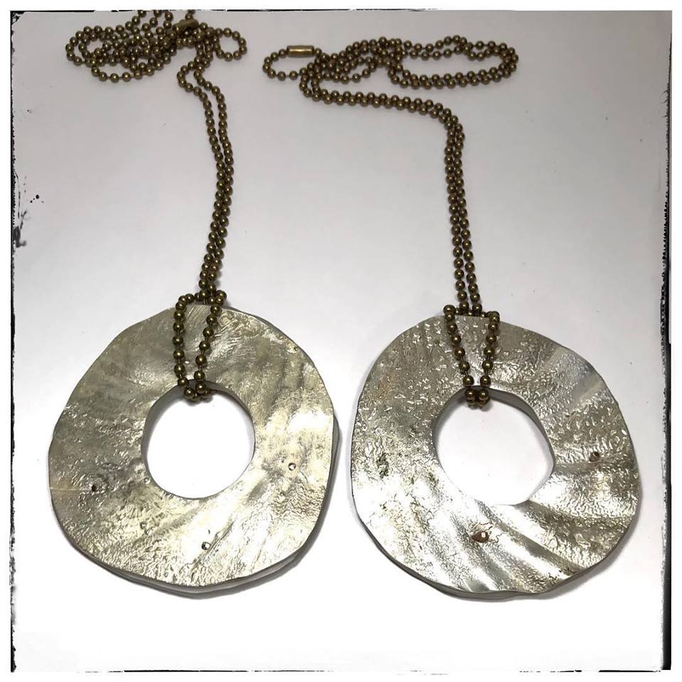 Roxy Lentz two long pendants of re purposed metal and Lucite. #artjewelry